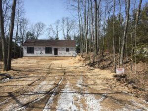 Driveway and site prep in front yard of new home