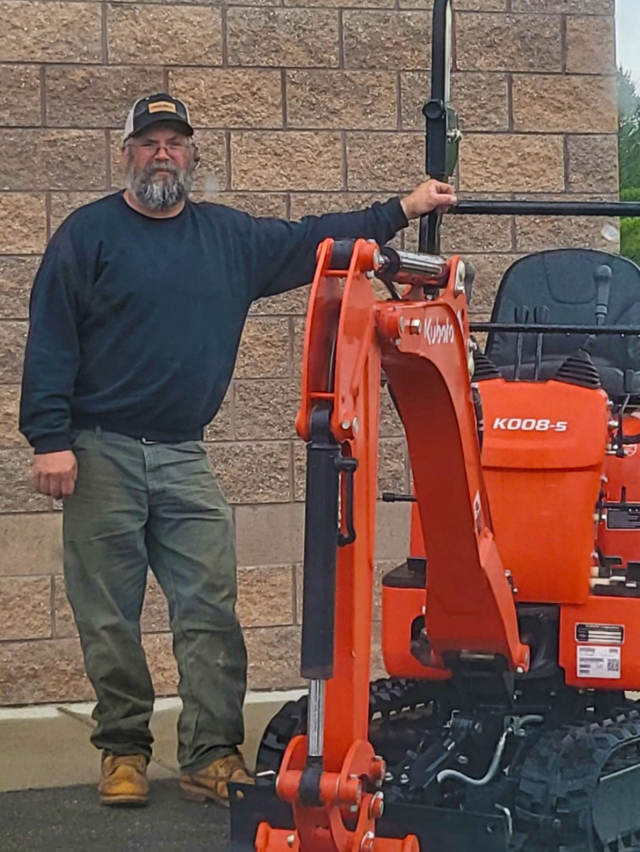 Greg Fredrickson with Kubota mini excavator