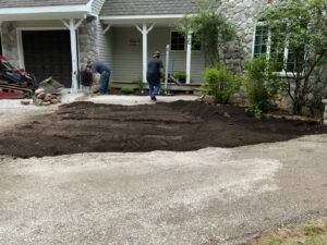 Front of home landscape project underway, base prep for walkway going in and dirt for yard being graded