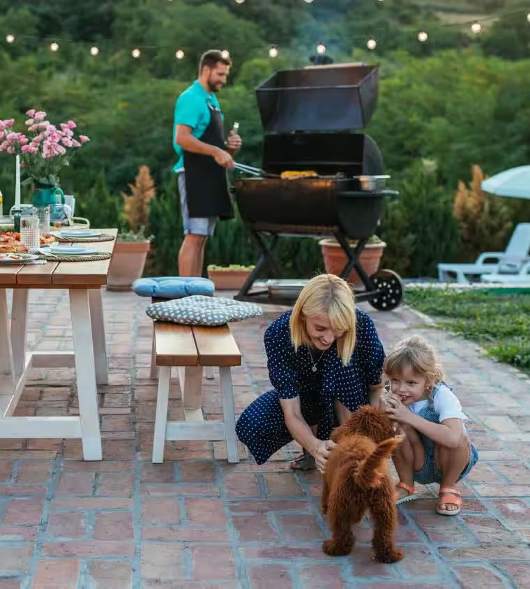 Happy family enjoying their newly landscaped yard