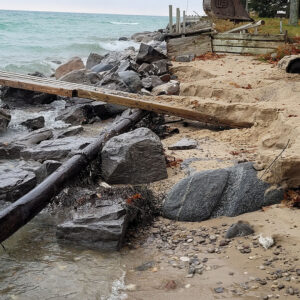 Eroded lakefront property with failing seawall in need of repair, Northport, MI