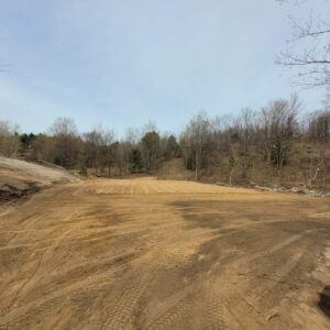 Excavation work completed on previously rolling overgrown terrain