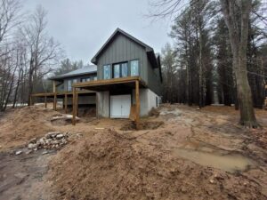 New home construction back yard in need of grading with dirt piled everywhere