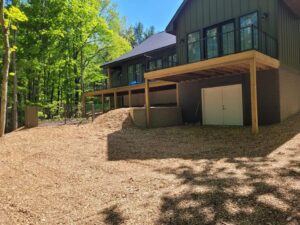 New home construction completed site work with final grading and yard prep completed in back yard